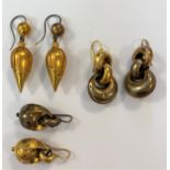 A trio of hollow earpendants,