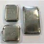 A novelty silver card case, a silver vesta by Sampson Mordan and another silver vesta,