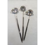 Three punch ladles each set with a George II coin,