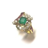 A modern emerald, diamond and ruby cluster ring,