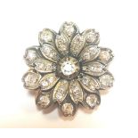 A diamond set flower brooch,