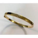 A Cartier style decorative bangle,