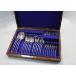 A canteen containing a 27 piece dessert set of George V silver flatware,