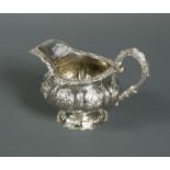 A William IV silver cream jug,