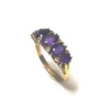 A modern amethyst carved head style ring,