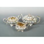 A George IV silver three piece tea service by William Bateman II,