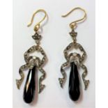 A pair of long drop earpendants set with diamonds and jet,