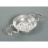 A George II silver lemon strainer,