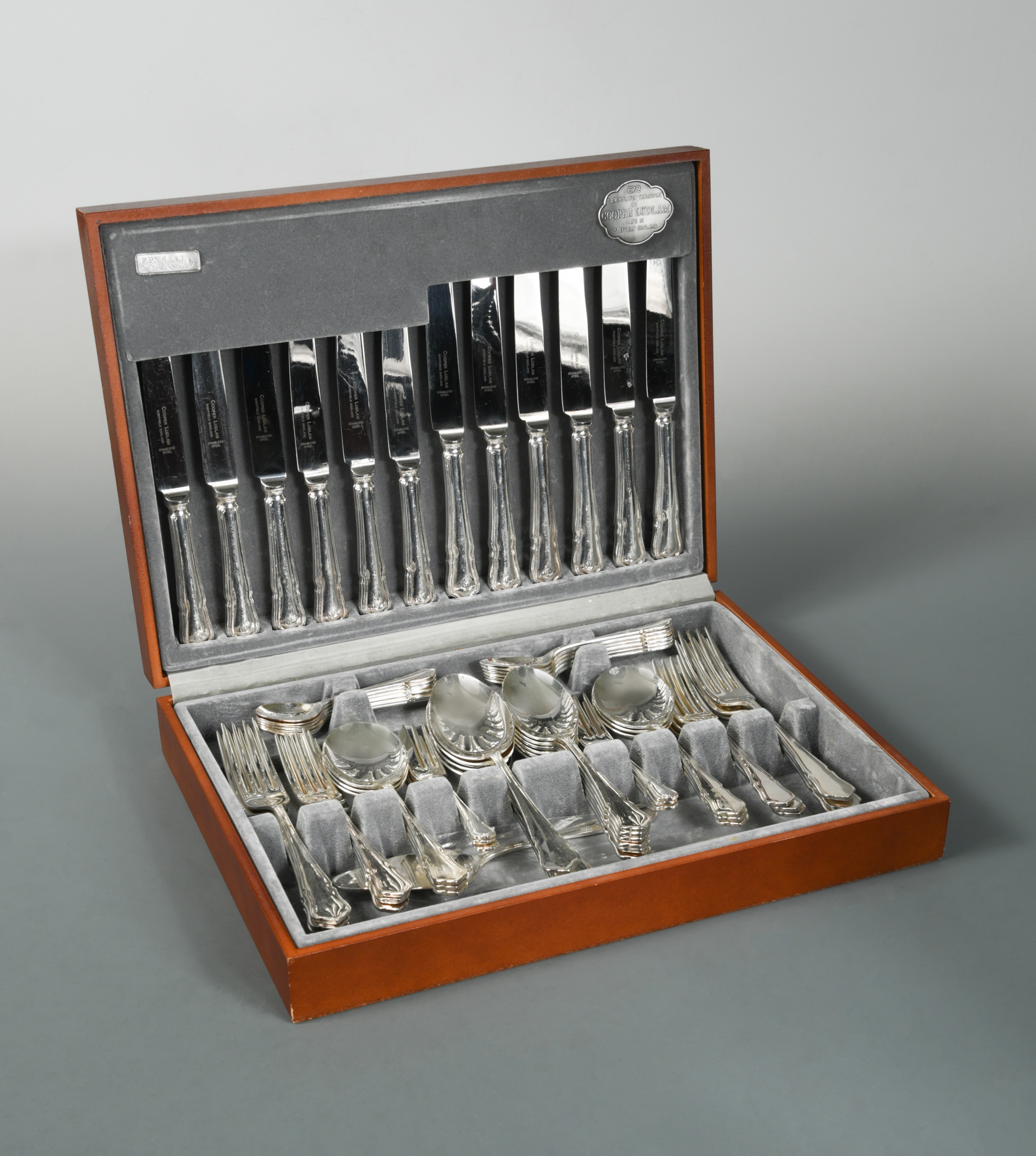 A canteen containing a 57 piece set of silver plated cutlery with two additions,