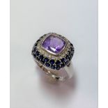 An amethyst, sapphire and diamond dress ring,