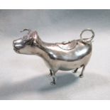 A (probably) Dutch metalwares Schuppe style cow creamer,