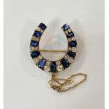 A late 19th Century sapphire & diamond horseshoe brooch,