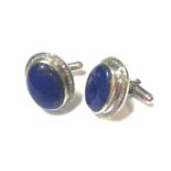 A pair of modern cufflinks set with diamonds and lapis lazuli,