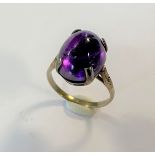 A cabochon amethyst and diamond ring,