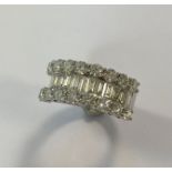 A modern half hoop ring set with diamonds,