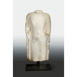 A Chinese grey limestone torso of the enrobed Buddha, in Northern Qi Dynasty style,