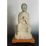 A Chinese stone seated Arhat, perhaps Tang Dynasty (618 AD - 907 AD),