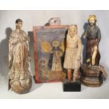 A group of three Philippines carved wood figures of saints,