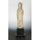 A Chinese grey stone standing figure of Guanyin, in Sui Dynasty style,
