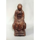 A Chinese carved and polychrome painted wood figure of a seated Buddha,