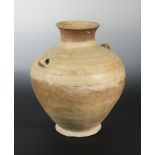 A Chinese olive glazed pottery vase Hu with lug handles, impressed/incised detail, probably Han,