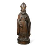 A carved softwood figure of a bishop, 17th century,