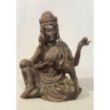 A Chinese carved wood figure of the four-armed seated Bodhisattva Guanyin, 20th century,