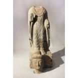 A Chinese grey stone standing figure of a Buddha, in Wei Dynasty style,