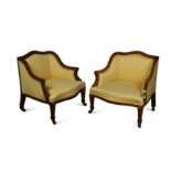 A pair of late Victorian low rosewood frame armchairs,