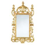 A carved and pierced giltwood wall mirror, 19th century,