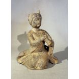 A Chinese green stone figure of a female musician, in Tang style,