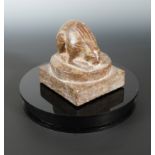 A Chinese red puddingstone crouched hare, in Sui Dynasty style,