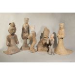A group of six Chinese painted grey pottery figures,