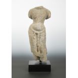 A Chinese limestone torso of an enrobed female figure, in Tang Dynasty style,