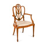 A Sheraton revival painted satinwood armchair,