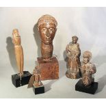 A group of five Philippines carved wood figures and heads of saints, 19/20th century