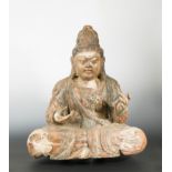 A Chinese carved and polychrome wood seated figure of Maitreya, with elaborate chignon,