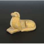 A Chinese pottery recumbent hound, Wei Dynasty,