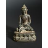 A Nepalese bronze seated figure of a Buddha, possibly 15th/16th century,
