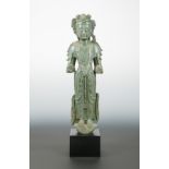 A highly decorative Chinese green marble standing figure of Avalokiteshvara, Northern Qi style,