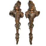 A pair of carved walnut Art Nouveau wall brackets,