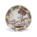 An 18th century Delft polychrome 'Adam and Eve charger,