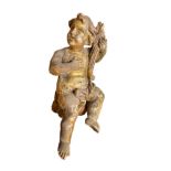 A carved gilt model putto,