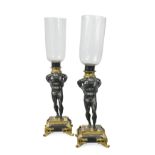 A pair of 19th century gilt and patinated bronze hurricane lamps,