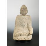 A Chinese cream sandstone figure of a Buddha, in early Sui Dynasty style,