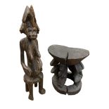 An African tribal stool with oval seat,