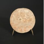 A bone circular plaque, possibly Central Asia,