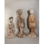 A group of three Chinese painted pottery large standing female tomb attendants,