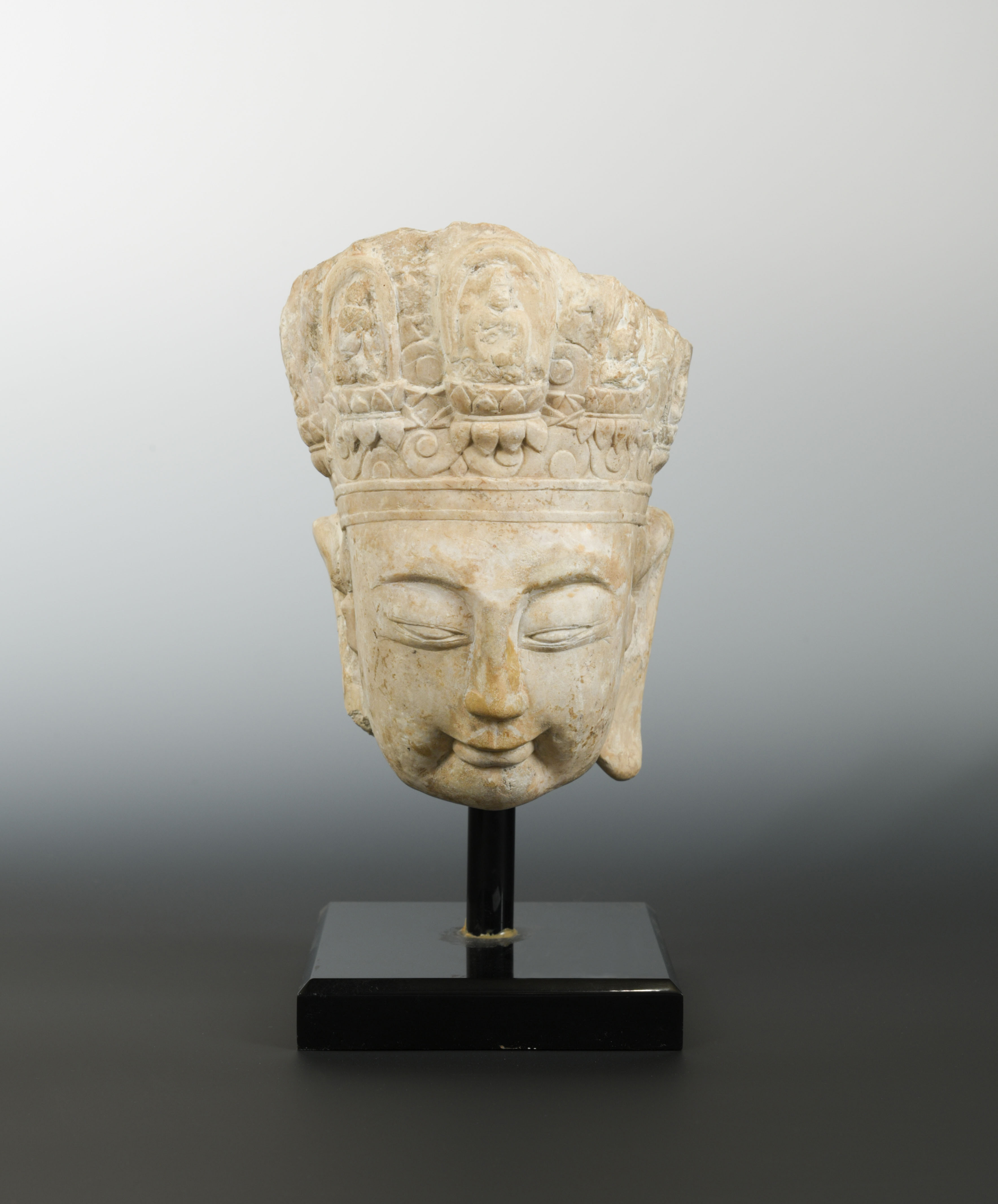A Chinese limestone head of Avalokiteshvara, perhaps Sui Dynasty (581-618 AD),