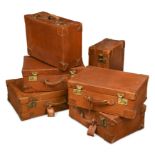 A set of early 20th century leather luggage,